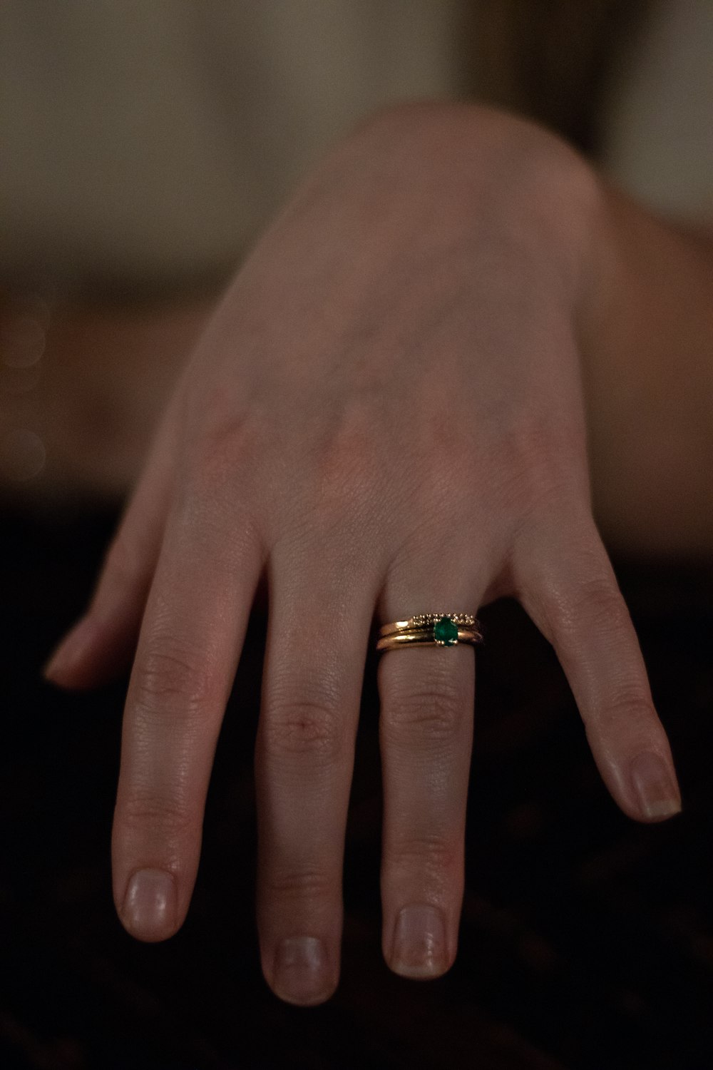 person wearing gold and diamond ring