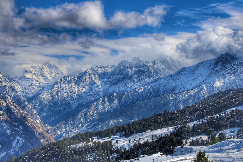 snow covered mountain under blue sky during daytime