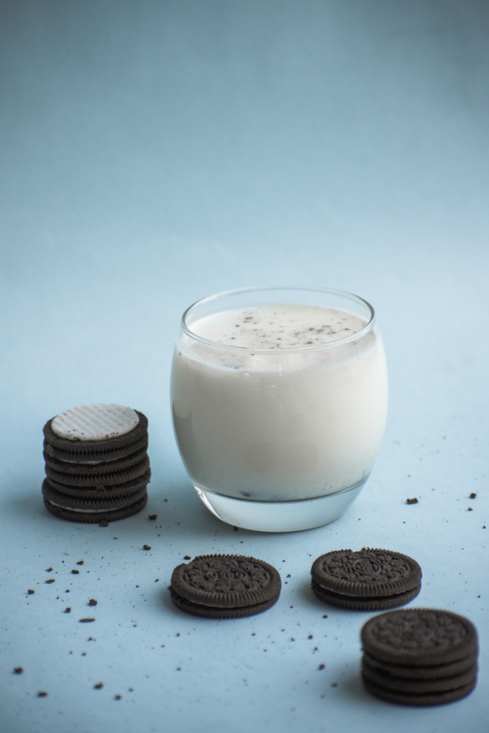clear drinking glass with milk and cookies