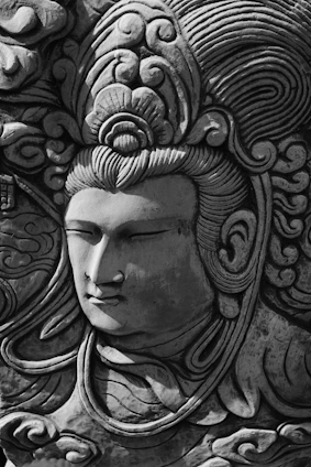 Close-up of a crystal engraving showcasing intricate 3D facial details with natural expression and clean hair lines.