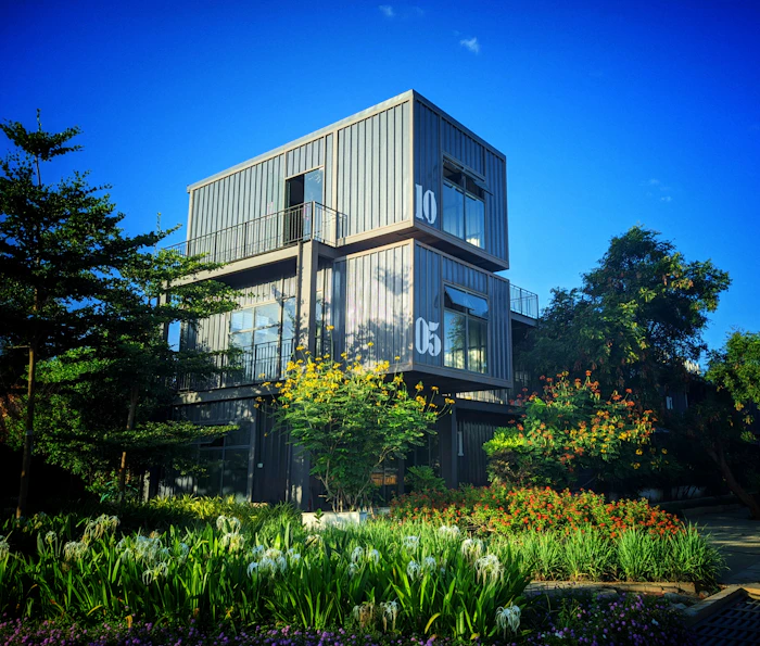 Modern container home exterior with concrete and glass design