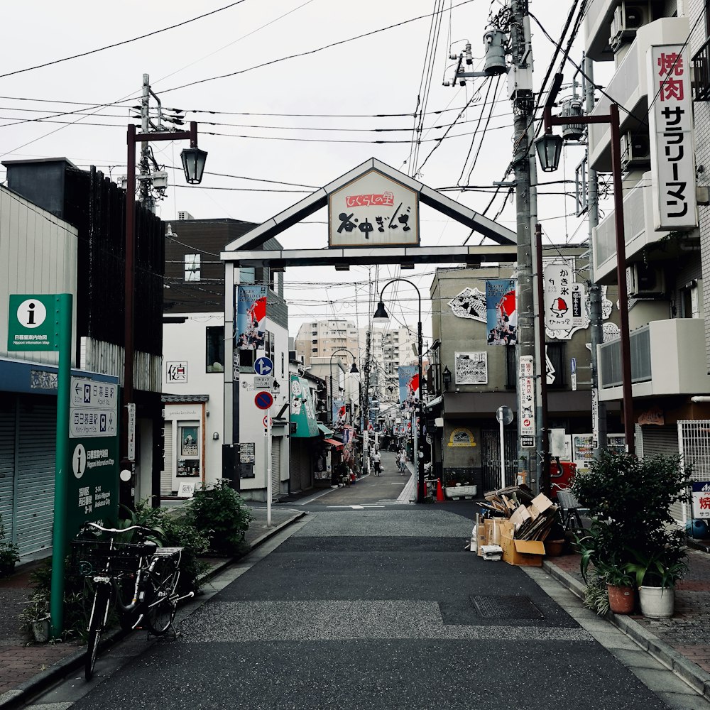 gray concrete road with cars parked beside