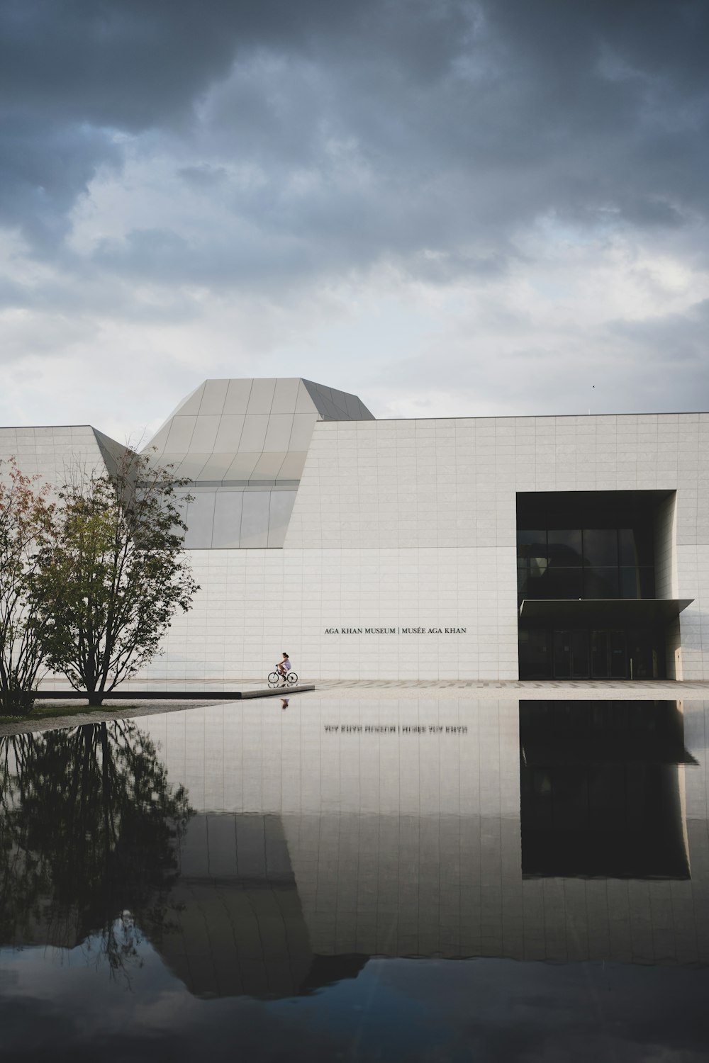 white concrete building near body of water during daytime