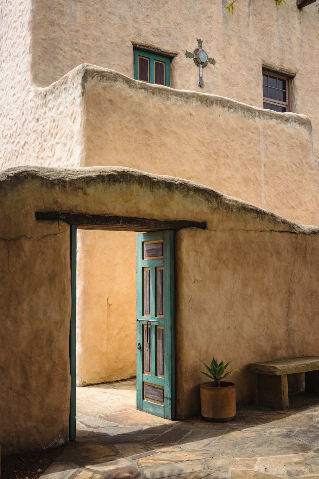 blue wooden door on white concrete building