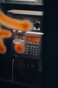 Close-up of a phone displaying the Credit Probe call center number.