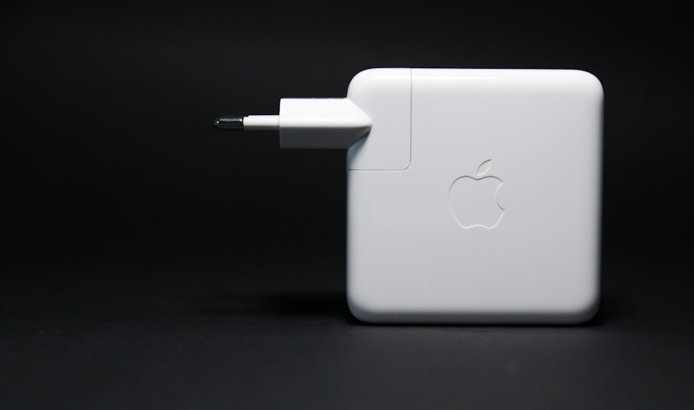 white apple macbook on black surface