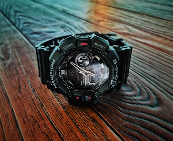 Close-up of a rugged Casio G-Shock watch with a black resin band and digital display.
