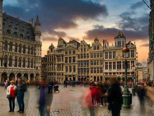 People walking on street near brown concrete building during daytime — Brussels, Belgium