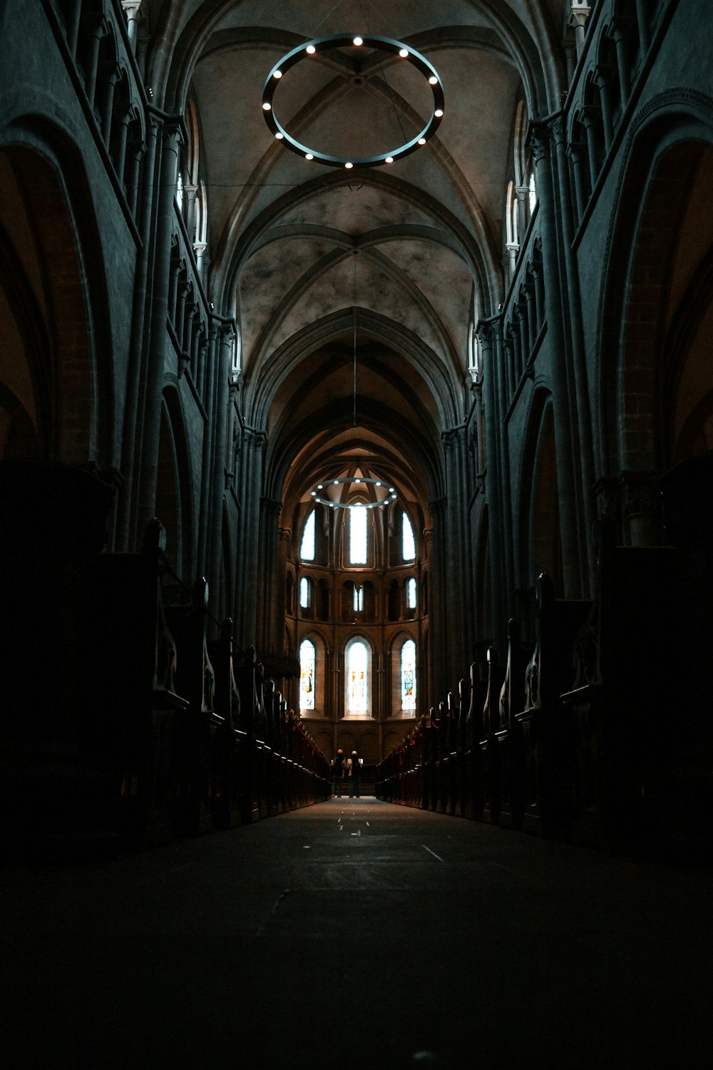 brown wooden hallway with white ceiling