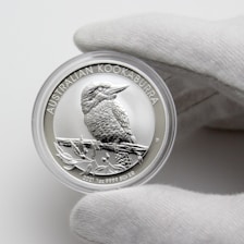 silver and gold round coin