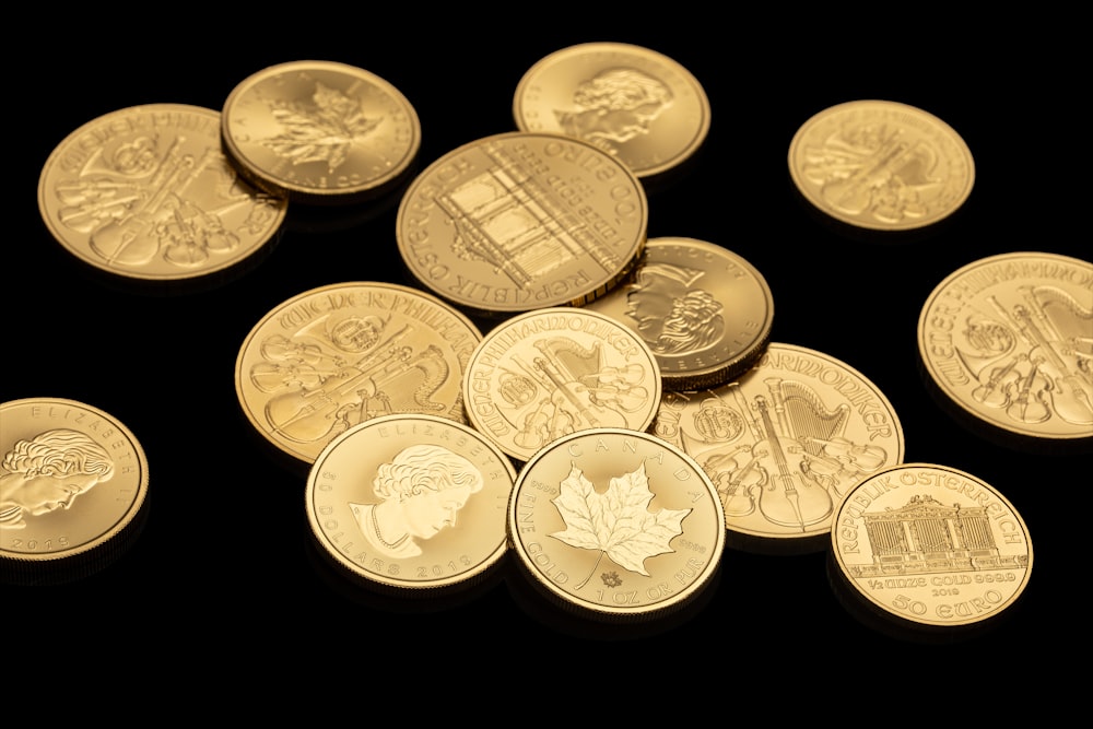 gold round coins on black background