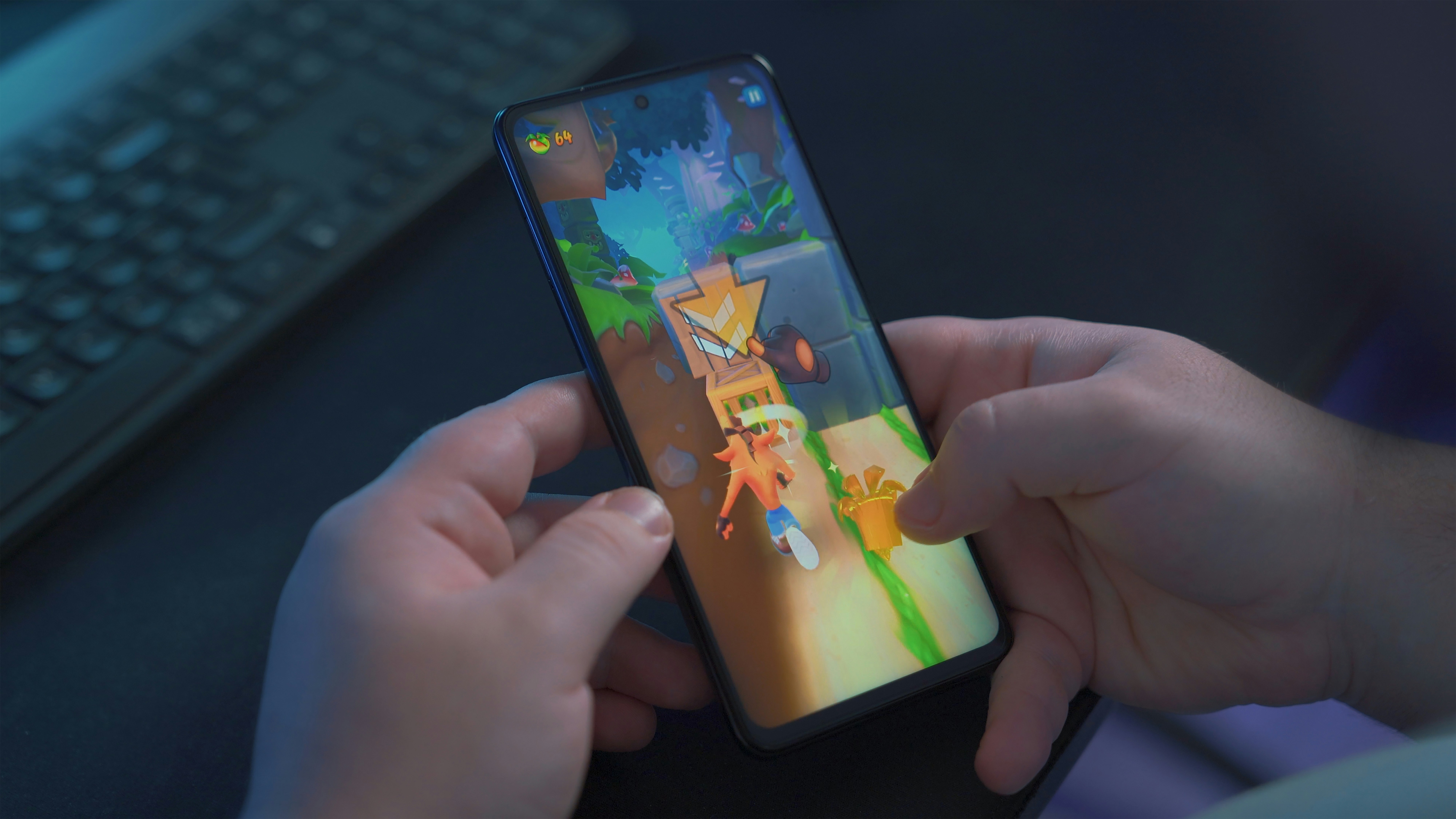Man playing games with Poco X3 Pro