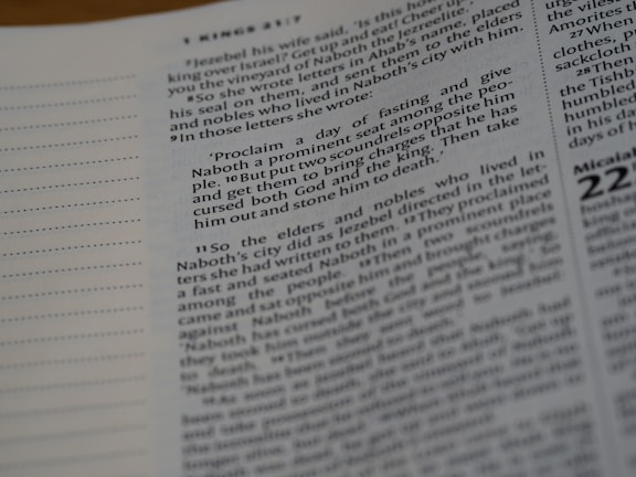 A close-up of a page from a book, featuring text printed in black on a white background. The text is arranged in paragraphs with numbered sections and some quotations. The left margin is visible, with dotted lines on the page.