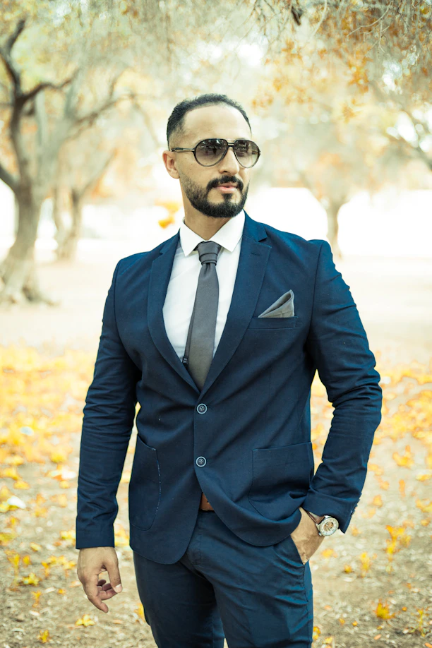 man in black suit wearing black sunglasses