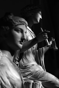 woman smoking cigarette in grayscale photography