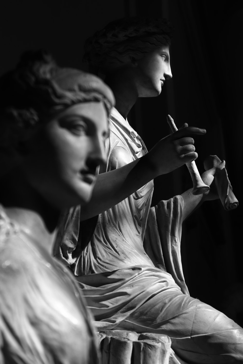 woman smoking cigarette in grayscale photography