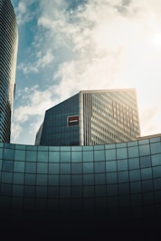 gray concrete building under white clouds during daytime
