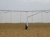 A contractor inspecting a large agricultural irrigation system using Ridhi Sidhi Industries fittings.