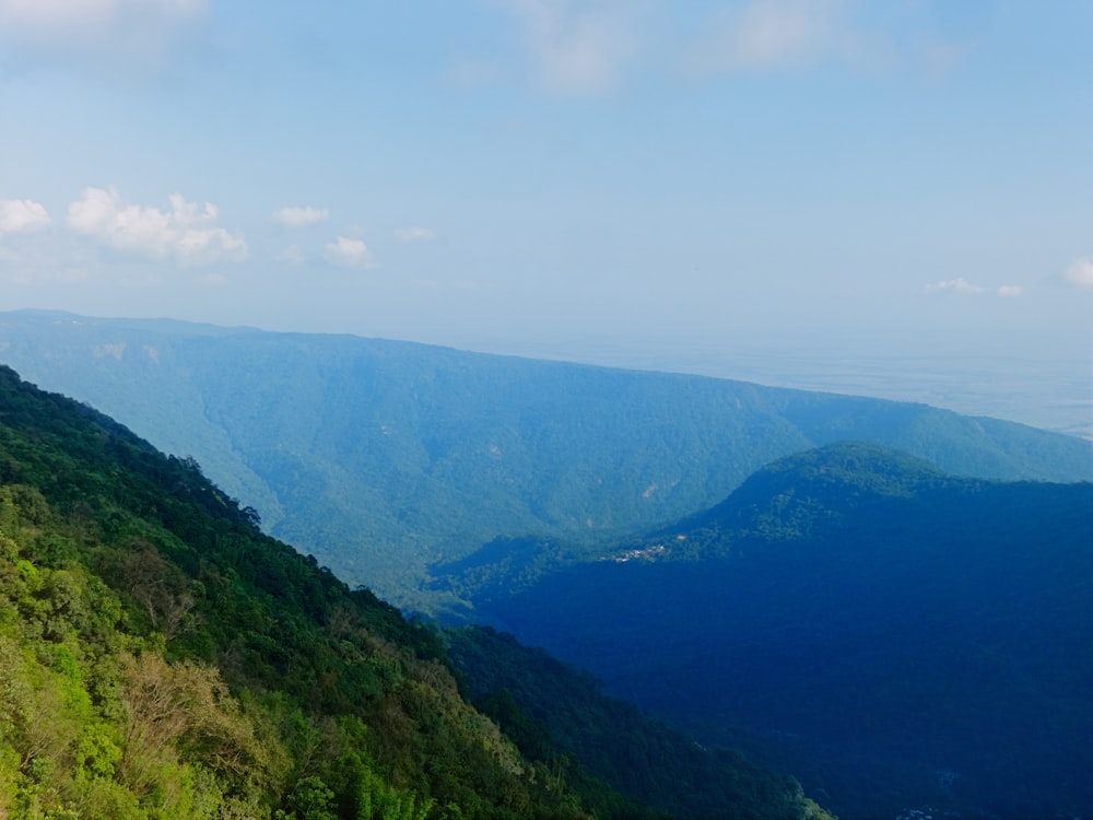 green mountains under white sky during daytime