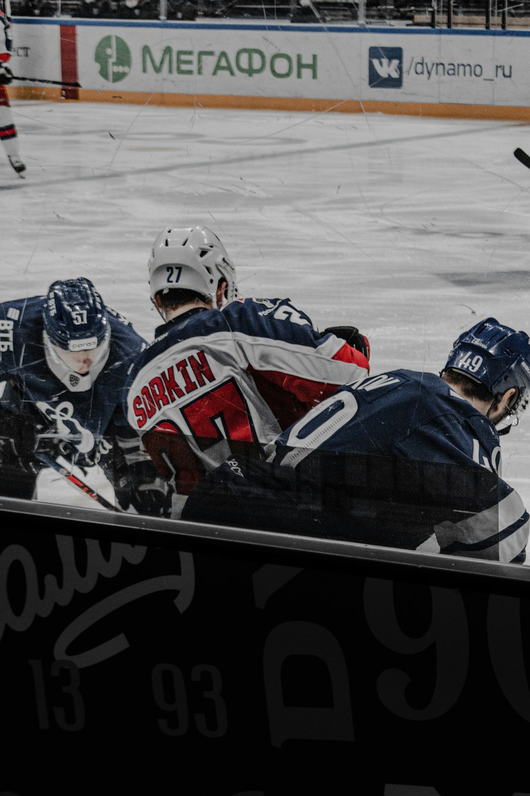 people riding on white and blue ice hockey players