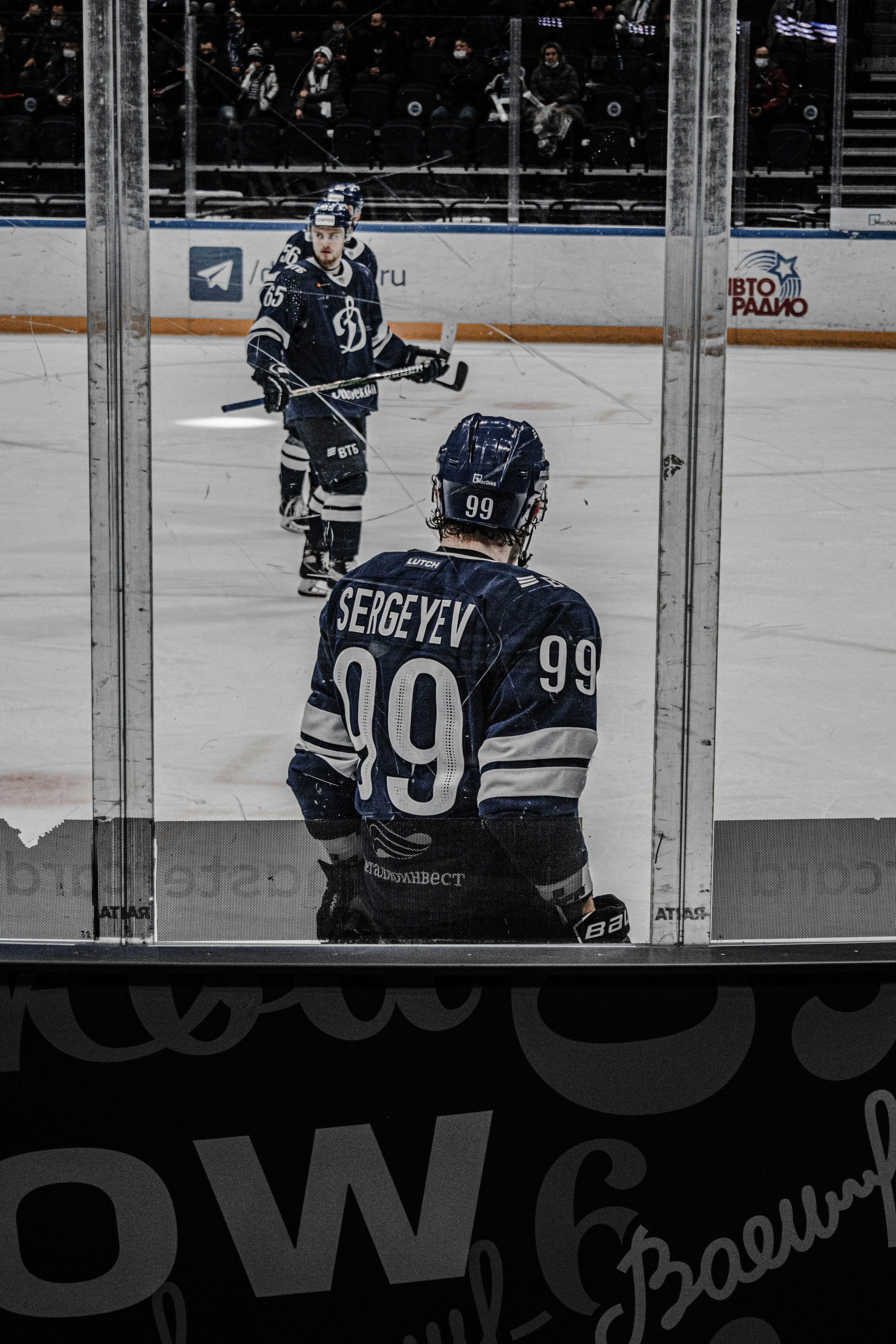 man in black and white ice hockey jersey