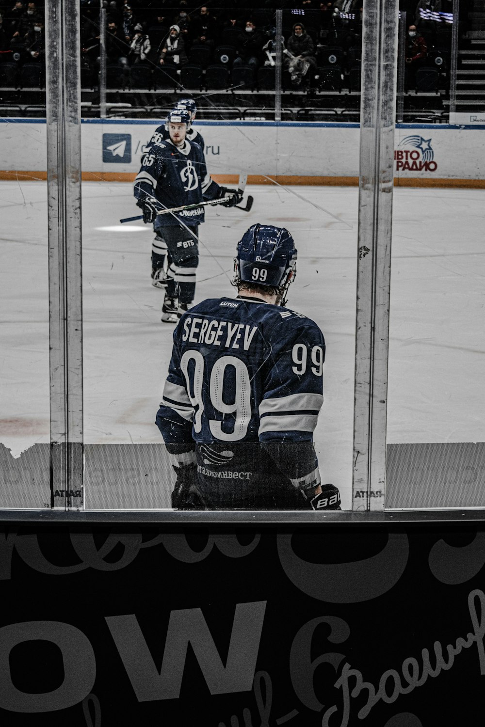 man in black and white ice hockey jersey