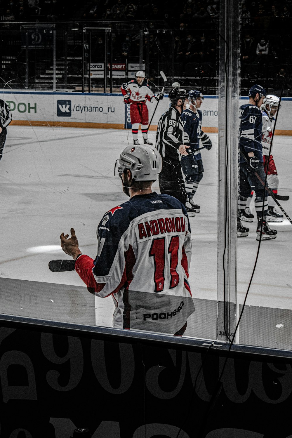 2 men playing ice hockey