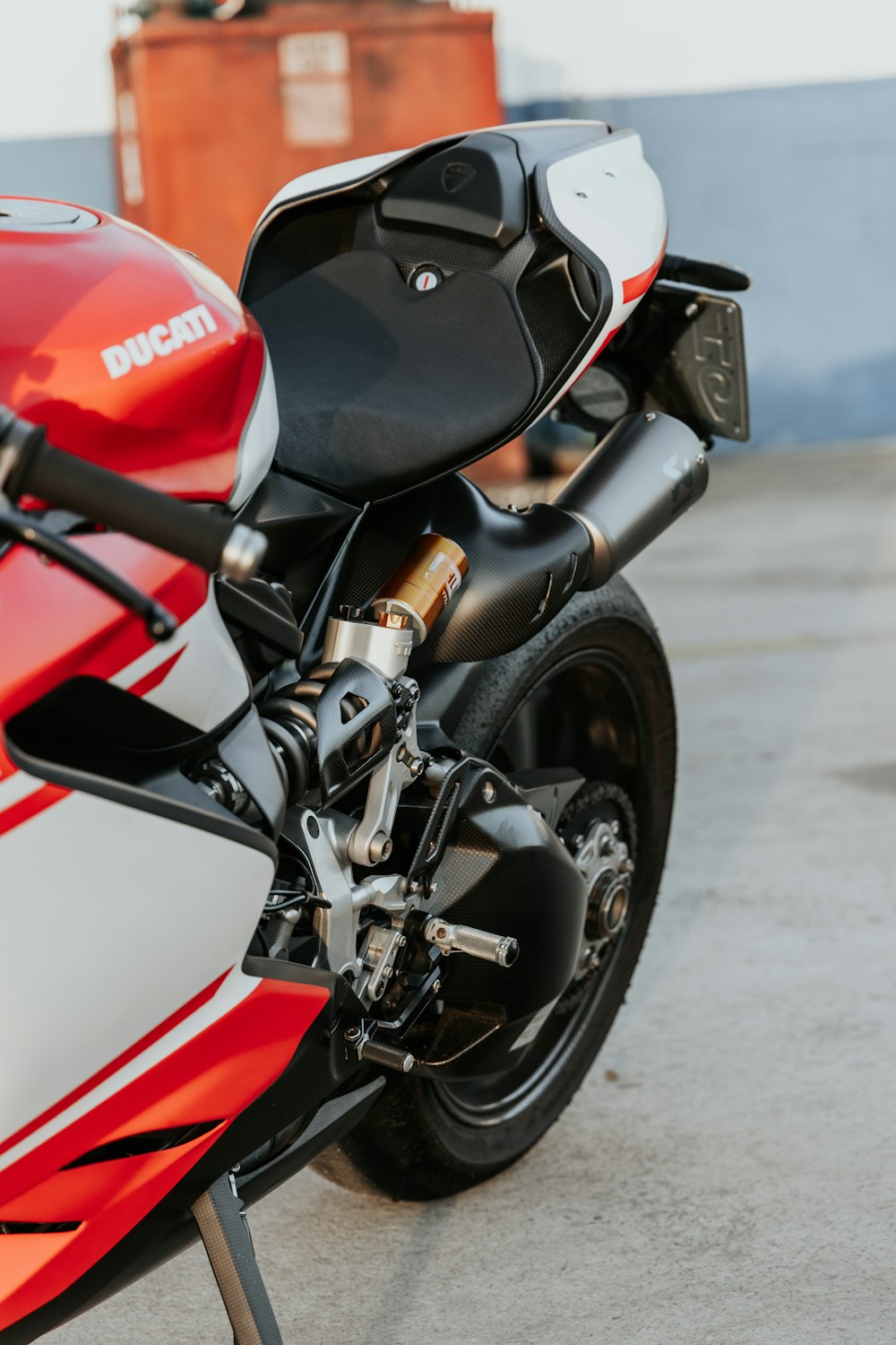 black and red motorcycle on road during daytime