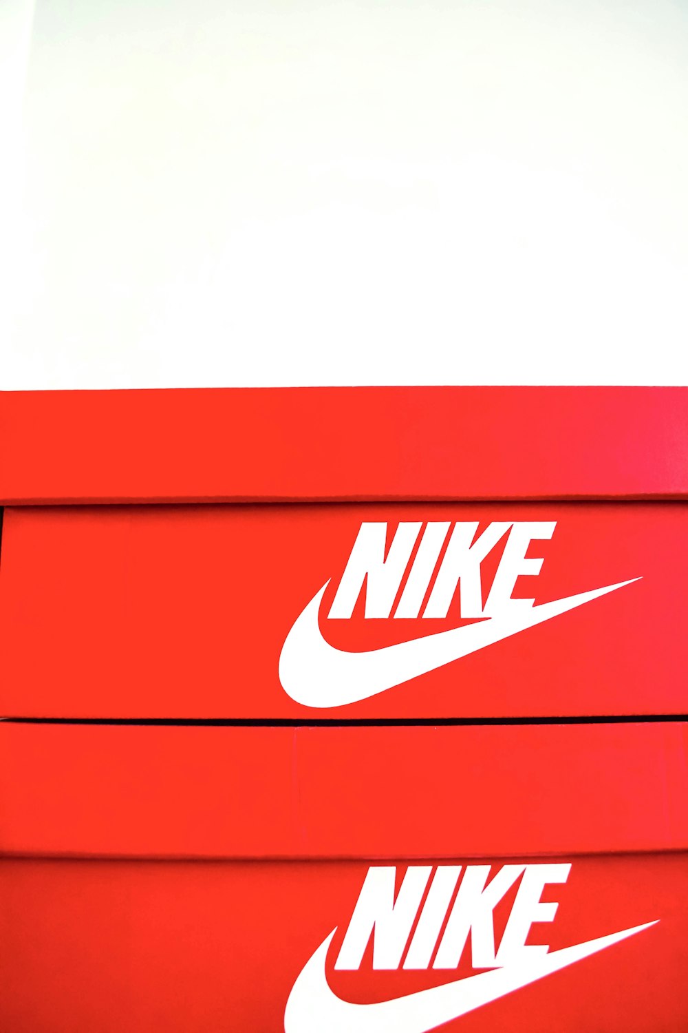 a red box with a white nike logo on it