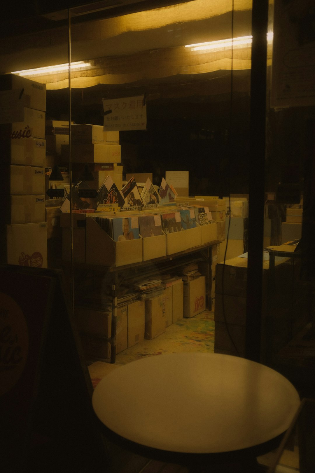 brown cardboard boxes on brown wooden shelf