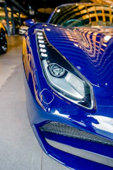 blue and silver car on road