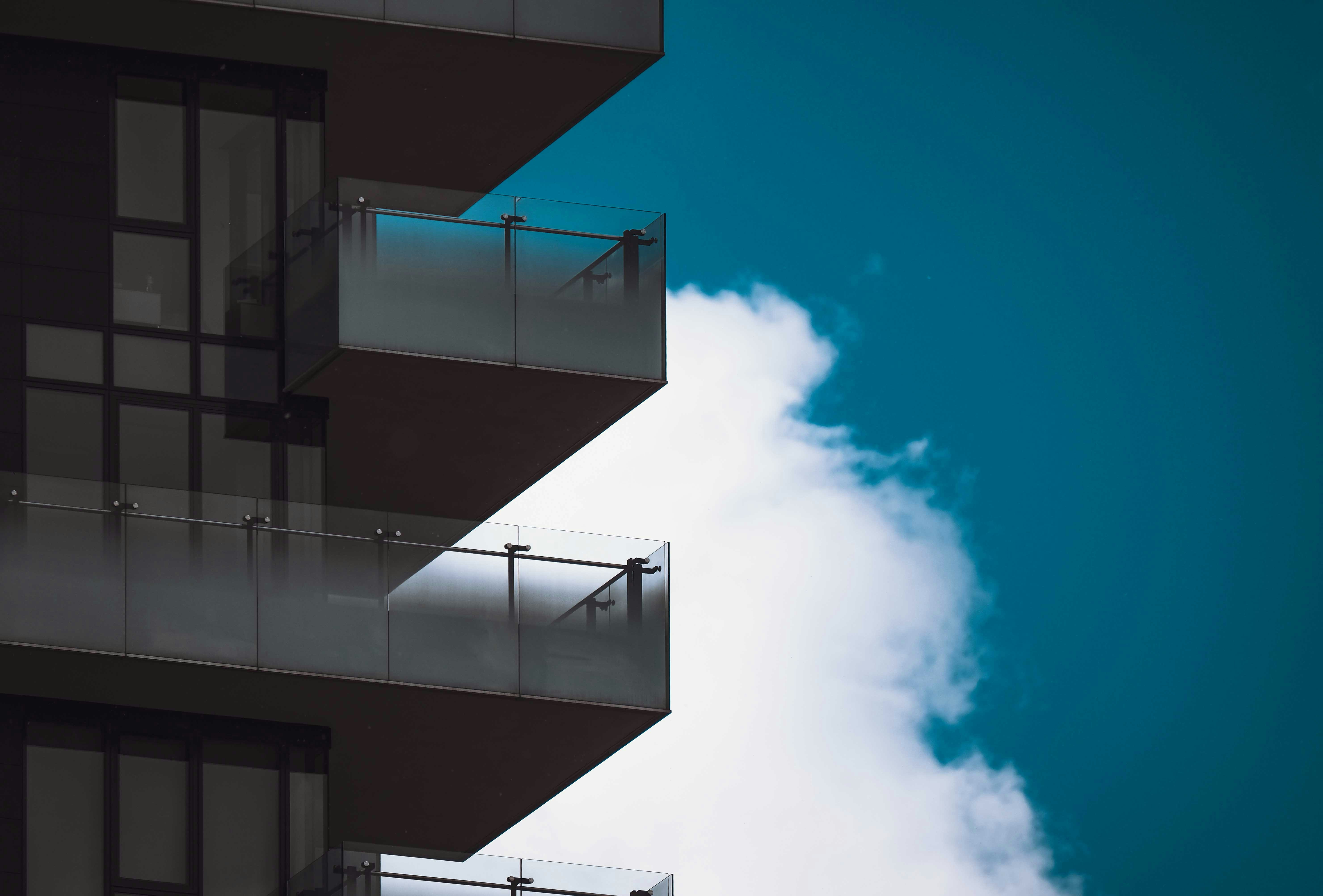 black and white concrete building under blue sky during daytime