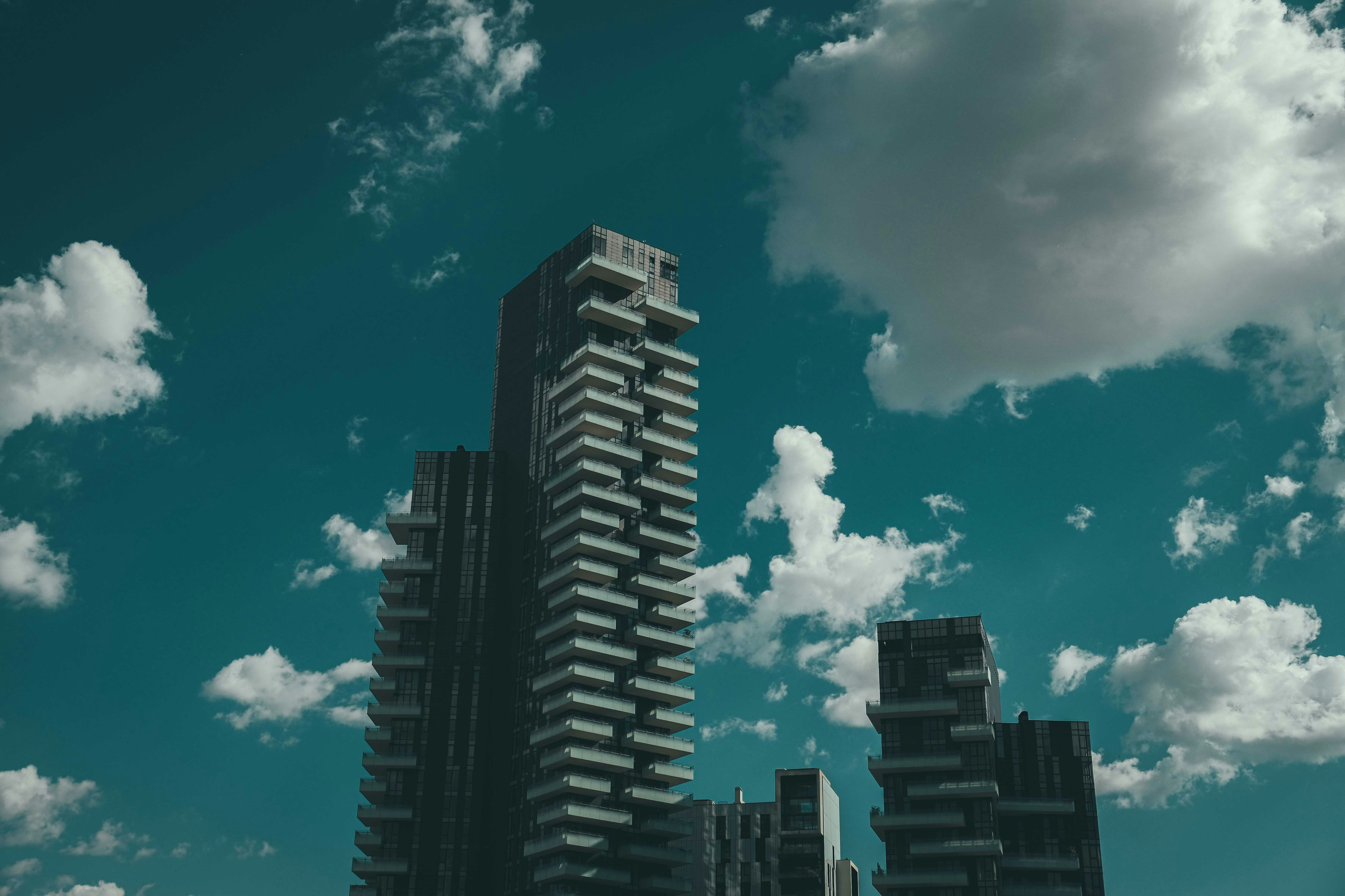 black and white concrete building under blue sky during daytime