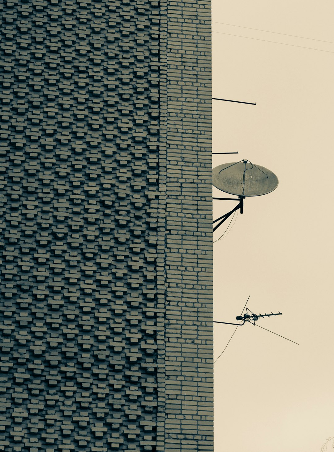 black satellite dish on top of building