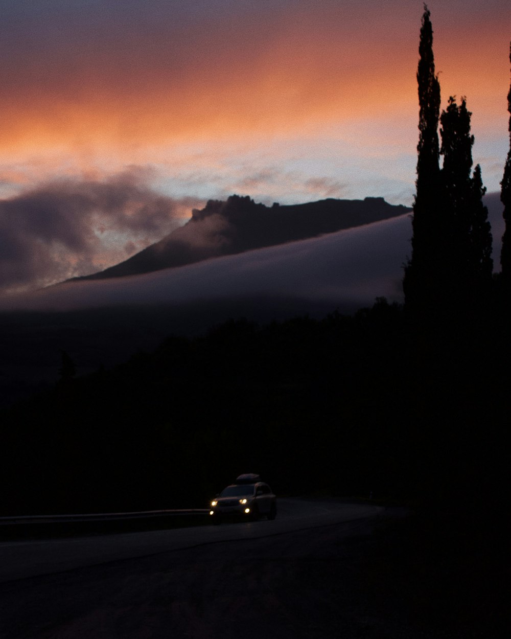 white car on road during night time