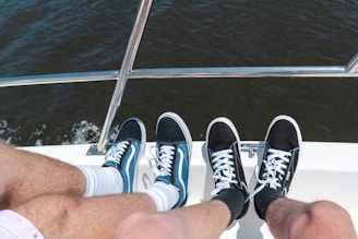 person wearing black and white sneakers