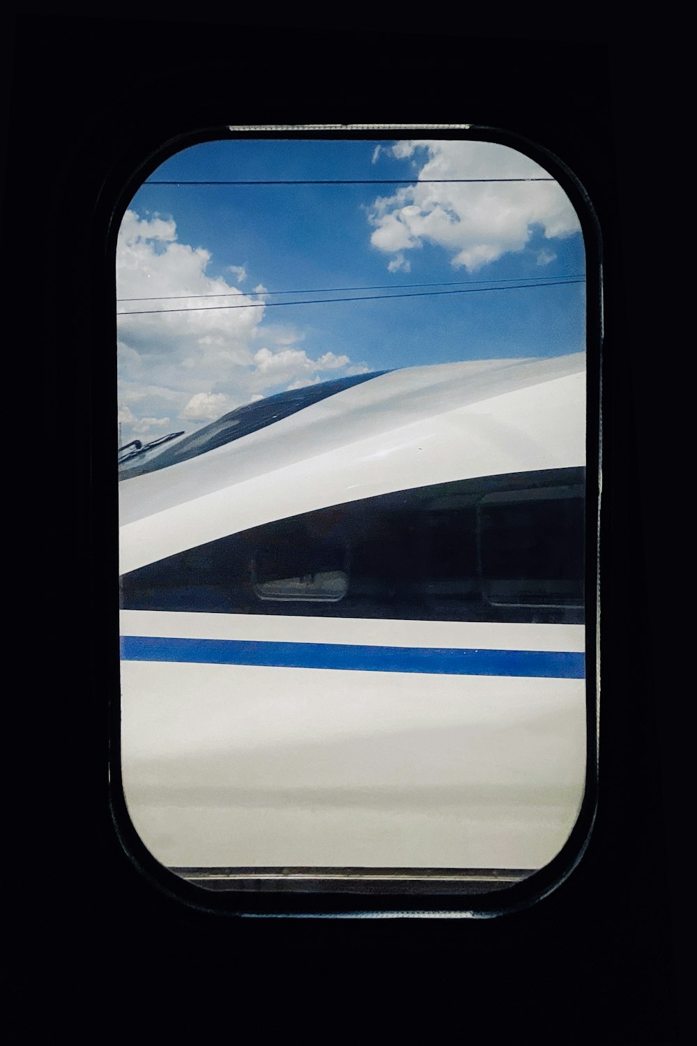 white and blue airplane window