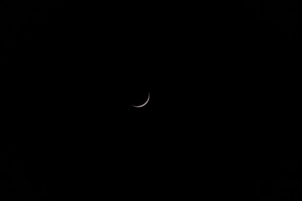 white crescent moon on black background