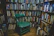 A cozy corner with a mother and child sharing a quiet moment, surrounded by books.