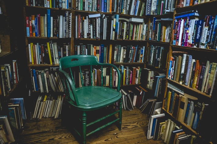 A cozy reading nook filled with books on sustainability and gardening.