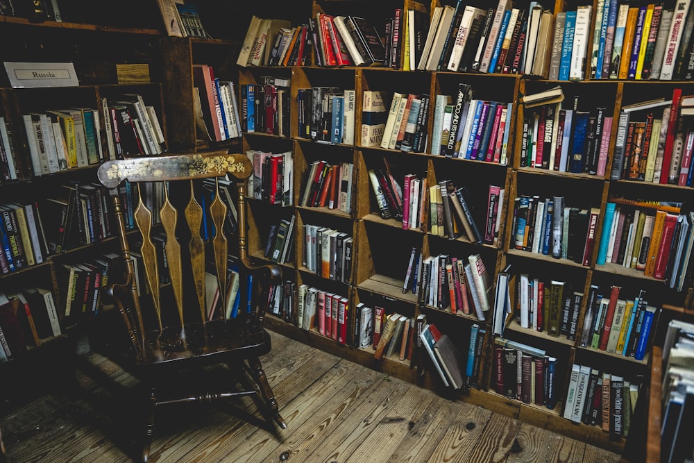 books on brown wooden shelf