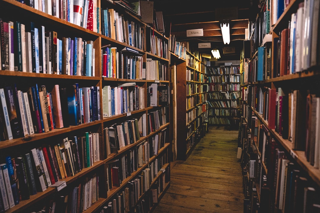 brown wooden book shelves with books,