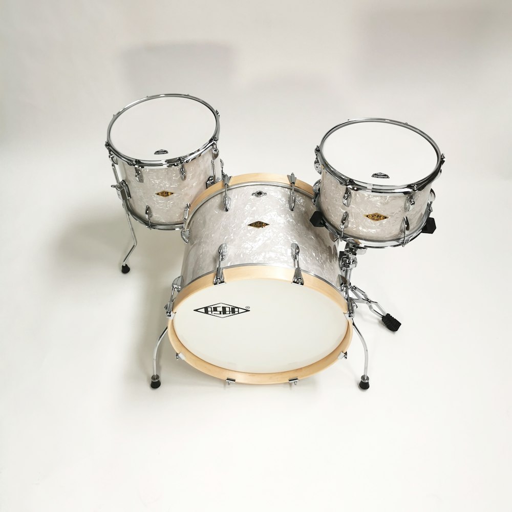 white and silver drum set