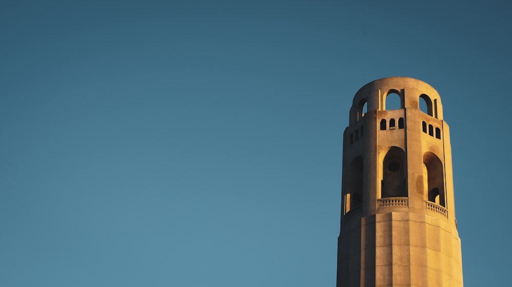 brown concrete building under blue sky during daytime