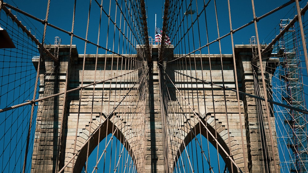 gray bridge under blue sky during daytime