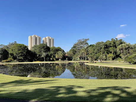 A serene public park with blue and green tones reflecting the brand colors.