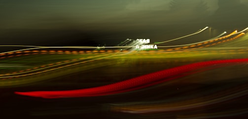 Blurred travel cards floating over a dark blue backdrop, hinting at endless destinations.