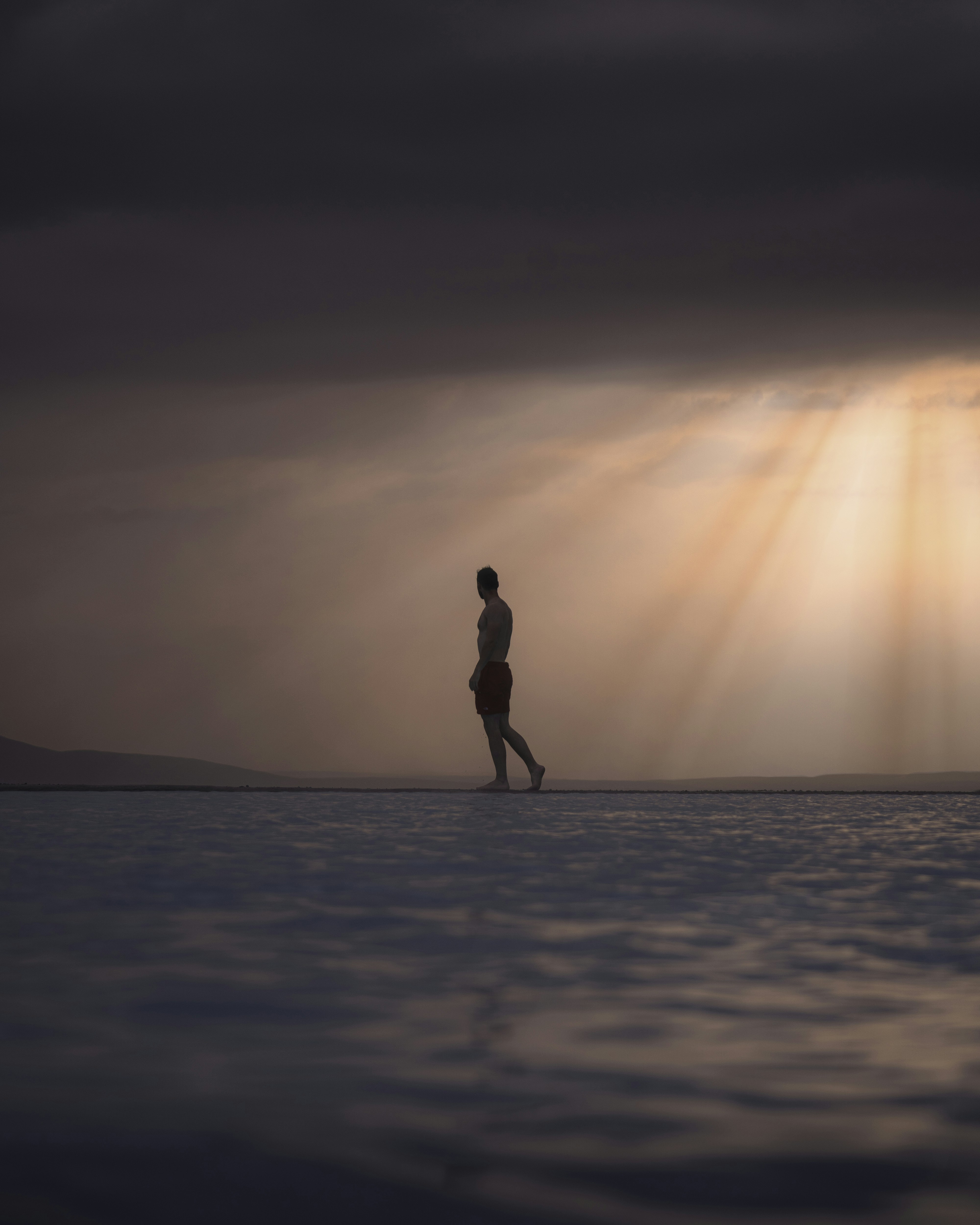 Silhouette of woman standing on beach during sunset photo – Free ...