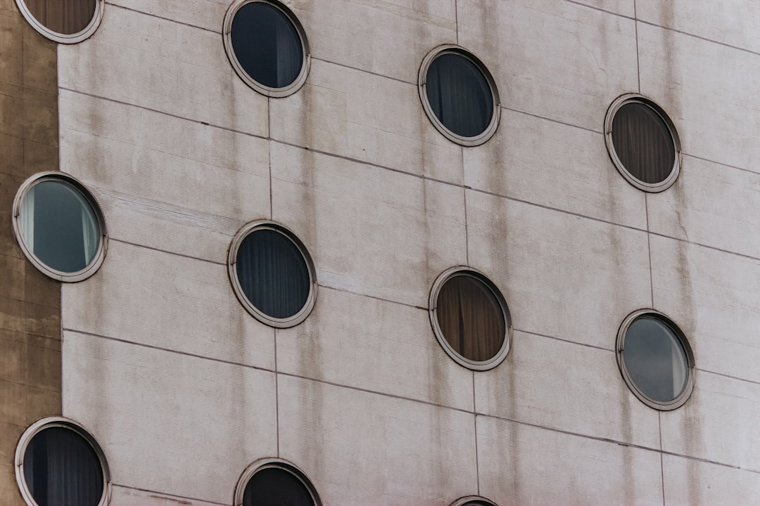 gray concrete building with round windows