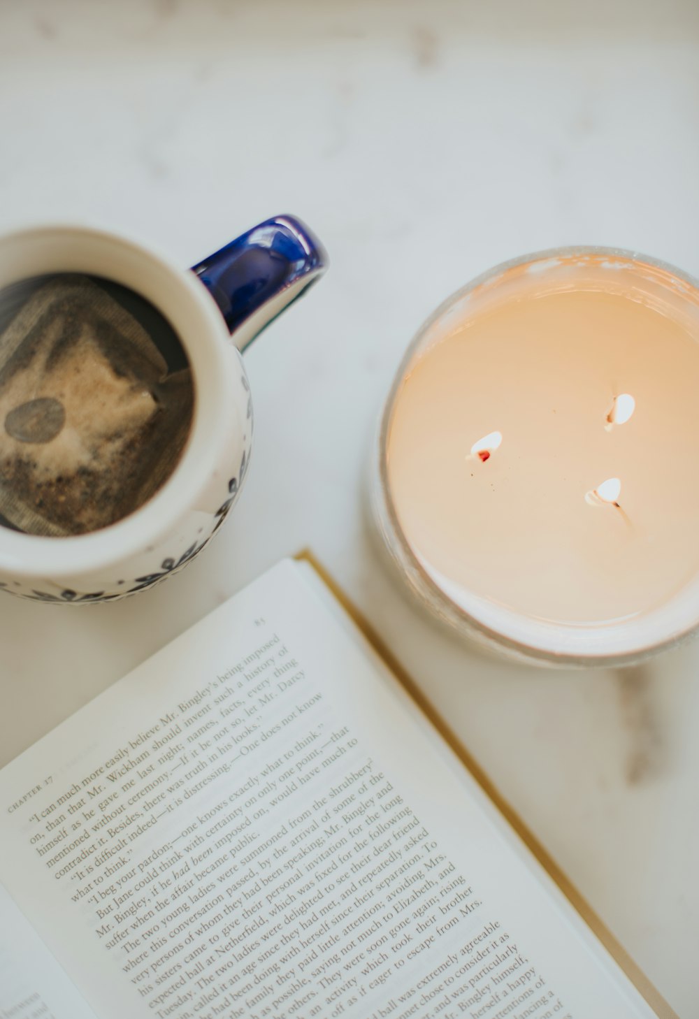 white ceramic mug beside white ceramic round plate